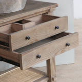 Reclaimed pine wood bathroom vanity with open drawer.