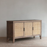 Reclaimed pine wood sideboard with rattan doors in a minimalistic room