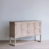 Reclaimed pine wood sideboard against a plain wall.