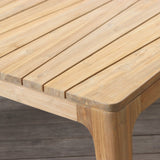 Wooden outdoor table on a wooden deck