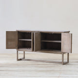 Reclaimed pine wood sideboard with open doors on a wooden floor and white wall background