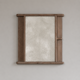 Wooden-framed mirror on a plain wall