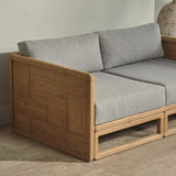 Outdoor wooden sofa with grey cushion on a wooden floor