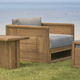 Outdoor wooden sofa 1 seater with end table and pouf on a grass