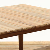 Wooden outdoor dining table with slatted top on a wooden floor with a white background