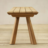 Wooden bench on a wooden floor with a neutral background