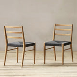Outdoor chair with synthetic rattan seating on a wooden floor.