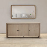 Reclaimed pine wood sideboard with a mirror above it..