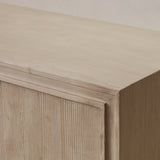 Reclaimed pine wood sideboard with a light finish on a neutral background