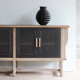 Half of LUNAR Sideboard (L) with a black vase on top if it.