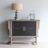 LUNAR Rattan Sideboard 2 doors with Pebbles Lamp and decorative items on top of it.