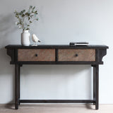 LUNAR Stone Console Table with white vase, decor item, and books on top of it.