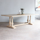 Monarch Dining Table with decorative items on top