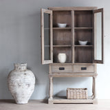 Monarch Glass Cabinet with the doors opened and white vase next to it.