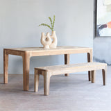 Arch Dining Table with vases on top, paired with Arch Bench.