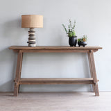 Vanity Console Table with Pebbles Lamp and potted lamp on top.