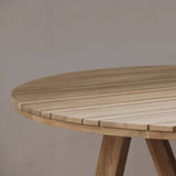 Wooden round table with a plain background