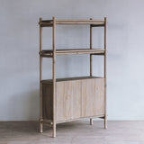 Reclaimed pine wood cabinet against a gray wall with a minimalistic design.