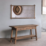 Reclaimed teak wood cabinet against a gray wall with decorative elements.