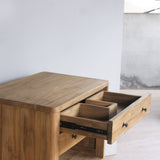 Wooden vanity with an open drawer in a minimalistic room