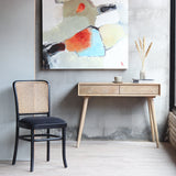 Moi Dining Chair and mid-century style desk at the background.