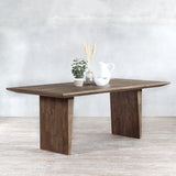KAMA Dining Table with decorative items on top of it