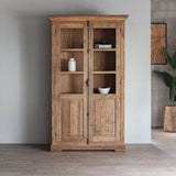 Front view of LYON Glass Cabinet with books and decoration items inside.