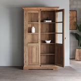 Front view of LYON Glass Cabinet with one door opened. There are books, vase and decorative bowl inside.