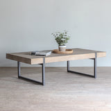 Massive Console Table with decorative plant, wooden tray and books on top of it.