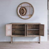 Reclaimed pine wood sideboard with open doors under a round mirror.