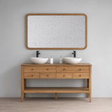 Wooden bathroom vanity with two sinks and a large mirror above it, set against a neutral wall.