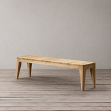 Wooden bench on a wooden floor with a plain background
