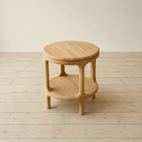 Wooden side table on a wooden floor with a neutral background