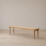 Wooden bench on a wooden floor with a plain background