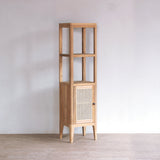 Wooden cabinet with rattan door in a minimalistic room