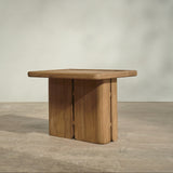 Outdoor wooden end table on a wooden floor