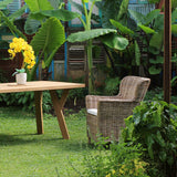 Aimann Kubu Chair next to Scandinavian Outdoor Table in a garden.