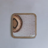 Squoval mirror on a light gray background