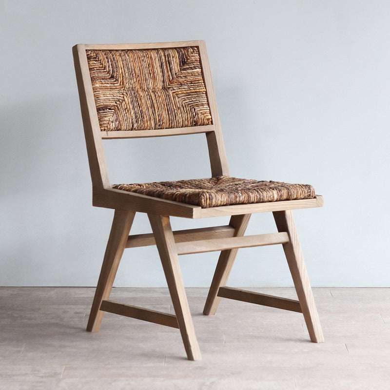 Dining Chair with Scandinavian design and woven banana seat and back-rest.