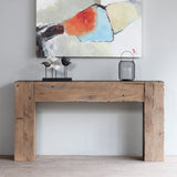 Dovetail Console Table with decorative items on top of if and an abstract painting hung above it.