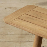 Wooden bench with a slatted design on a wooden floor