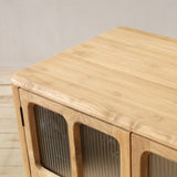 Wooden cabinet with framed glass doors on a wooden floor.