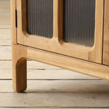 Wooden cabinet with framed glass panels on a wooden floor
