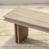 Reclaimed pine wood bench on a wooden floor