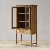 Wooden cabinet with open door on a light wooden floor and gray wall background