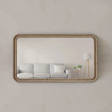 Rectangular mirror with wooden frame on a plain wall