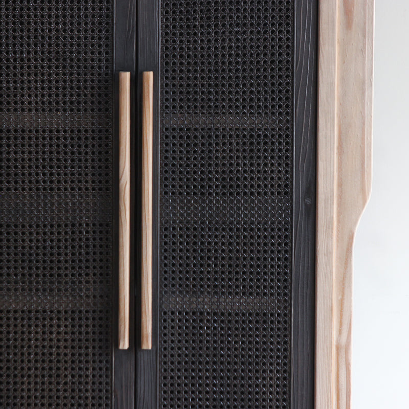 Detail of LUNAR Rattan rattan webbing doors' texture and handles.
