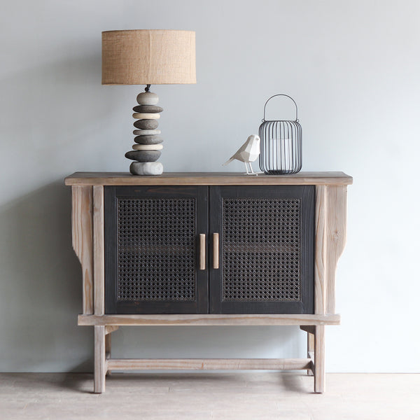 LUNAR Rattan Sideboard 2 doors with Pebbles Lamp and decorative items on top of it.