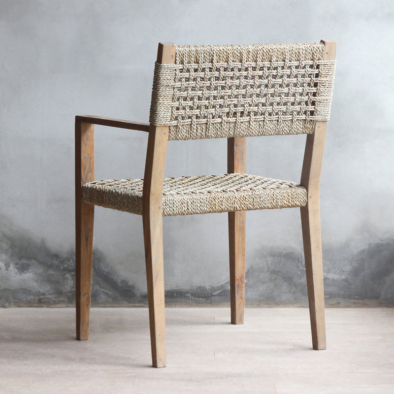 A back view of LYON Dining Armchair. Showing the woven sisal backrest's pattern.