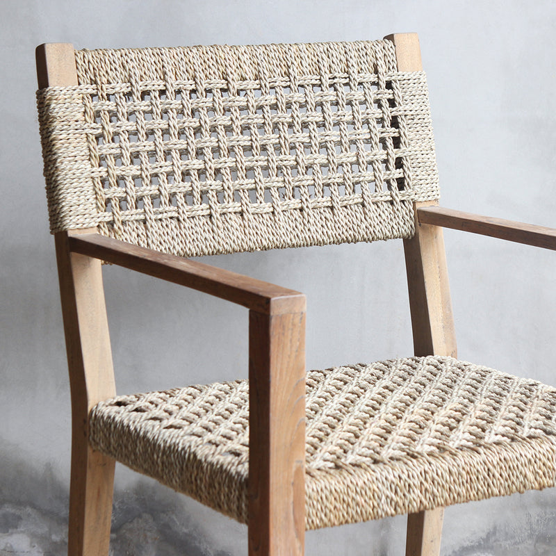 A detailed view on the backrest and seat sisal weaving of LYON Dining Armchair..